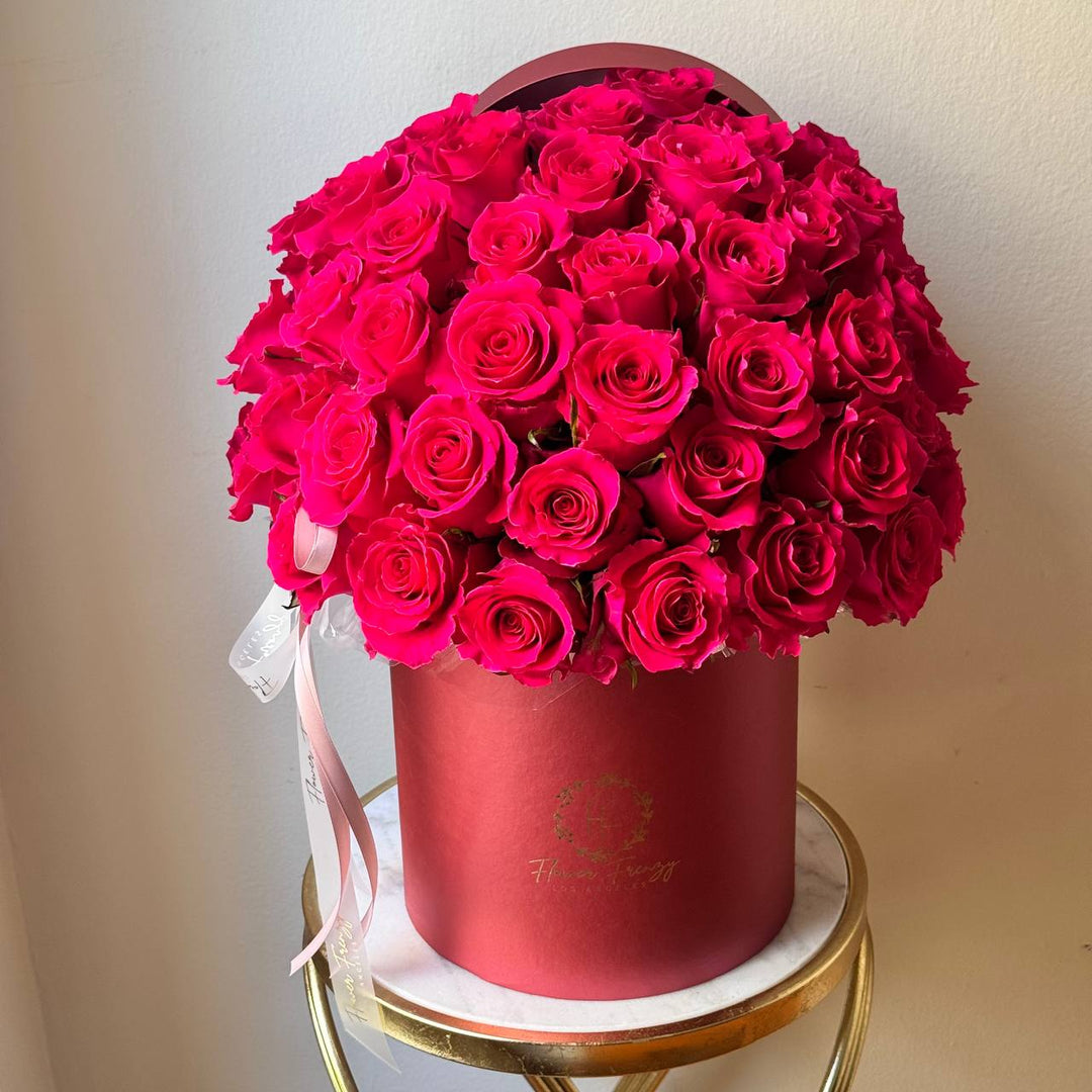 432. Pink roses in red box