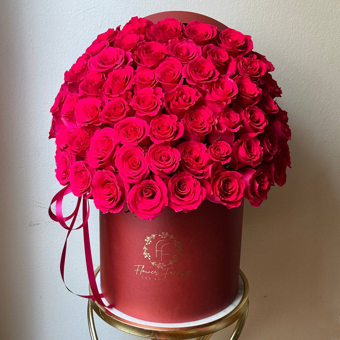 432. Pink roses in red box