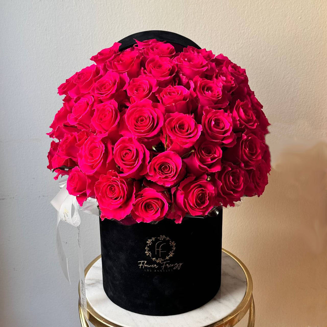 431. Pink roses in black box